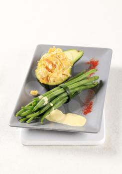 Vegetarian meal - Avocado with scrambled eggs and green beans