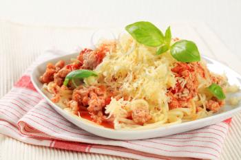 Spaghetti with minced meat stir fry sprinkled with cheese
