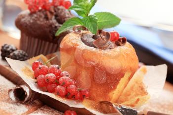 Tasty cupcakes garnished with fresh berry fruit 