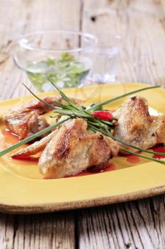 Roast chicken wings with crushed potatoes and sweet sauce