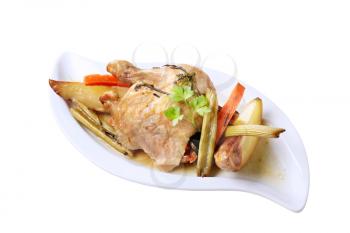 Cooked chicken leg and vegetables