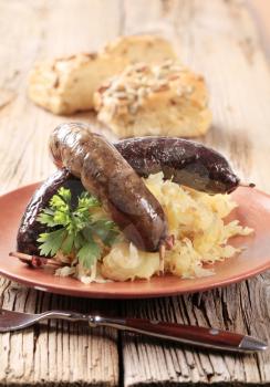 Pan roasted sausages with sauerkraut and potatoes