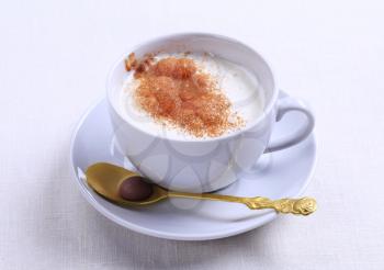 Vanilla steamer with a dusting of nutmeg or cinnamon