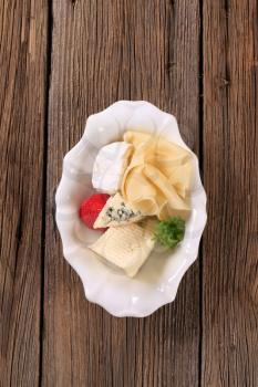 Assorted cheeses in a bowl
