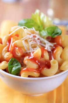 Bowl of pasta with tomato sauce and cheese