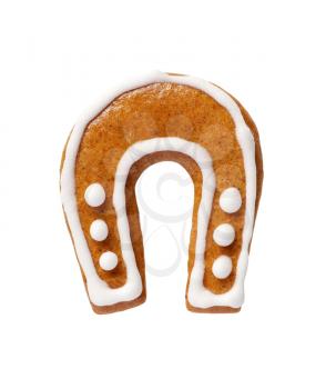 Horseshoe-shaped gingerbread cookie isolated on white background  