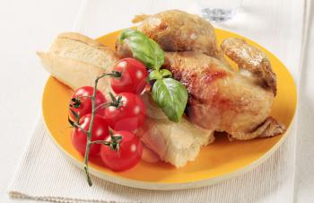 Roast chicken with French bread and tomatoes