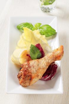 Roasted chicken drumstick served with mashed potato