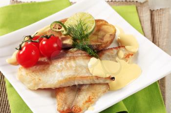Pan fried fish fillets and Hollandaise sauce