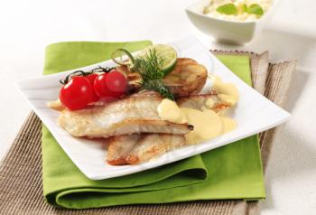 Pan fried fish fillets and Hollandaise sauce