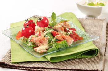 Salmon salad drizzled with Hollandaise sauce - closeup 