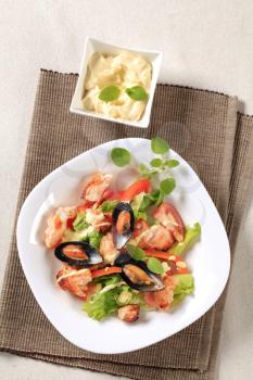 Seafood salad with pan fried salmon and mussels