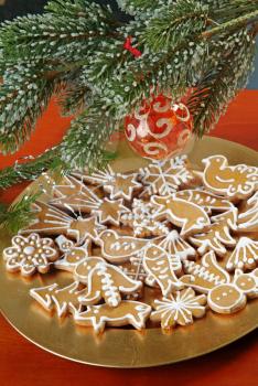 Christmas gingerbread gookies
 under evergreen branch