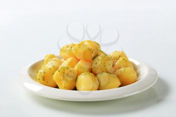 Cooked potatoes with butter and parsley