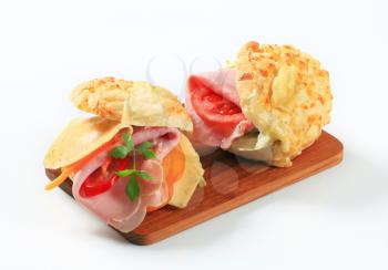 Ham and cheese sandwiches on cutting board