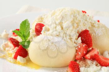 Strawberry dumpling with cottage cheese, sugar and butter