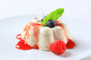 Panna cotta with fruit coulis and wild berries