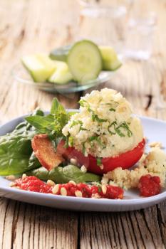 Vegetarian appetizer - Fresh tomato stuffed with couscous 
 