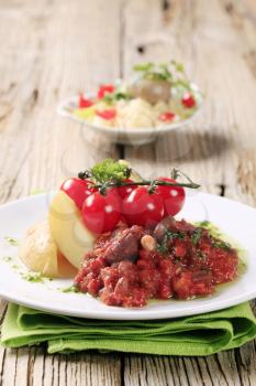 Vegetarian dish of beans and tomato with new potatoes 