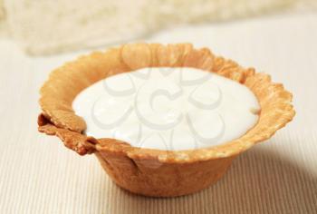 Wafer cup filled with lemon cream