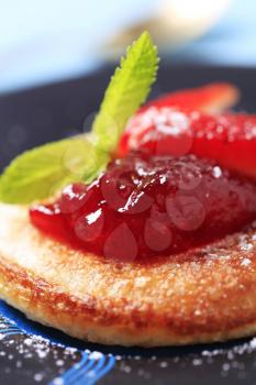 Pancake garnished with strawberry jam - detail