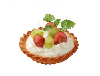 Small cream tart topped with fresh grapes