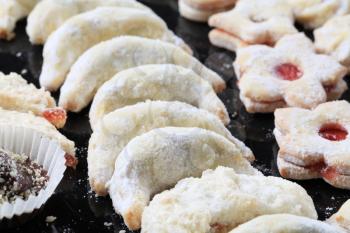 Christmas cookies sprinkled with icing sugar - detail