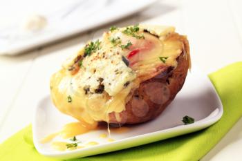 Double cheese twice baked potato sprinkled with parsley