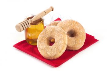 Donuts and a jar of honey - still life