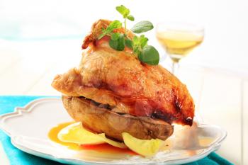 Roasted chicken with crispy skin and baked potato 