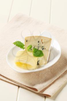 Blue Brie cheese and curl of fresh butter