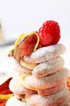 Crescent-shaped vanilla cookies with pudding and fruit