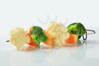 Pieces of fresh vegetables on a skewer 