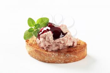 Toasted bread with pate and cranberry sauce