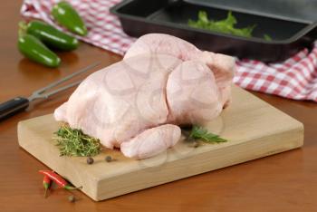 Raw chicken on a cutting board
