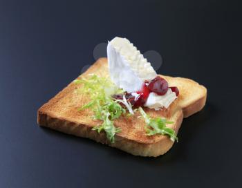 Slice of toasted bread and French cheese
