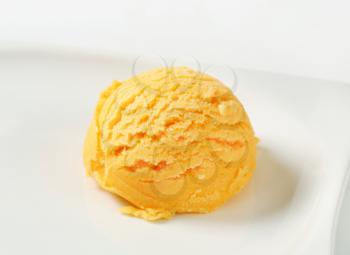 Scoop of orange ice cream