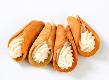 Czech cone-shaped gingerbread cookies (Stramberk ears) filled with whipped cream