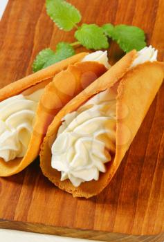 Czech cone-shaped gingerbread cookies (Stramberk ears) filled with whipped cream