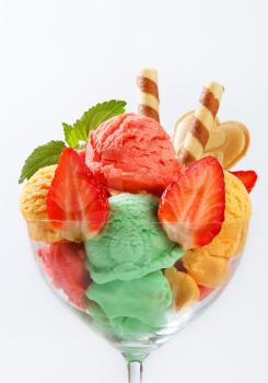 Fruit sherbets decorated with wafers and fresh strawberries