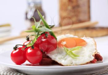 Vegetarian dish of red bean and tomato salad and fried egg