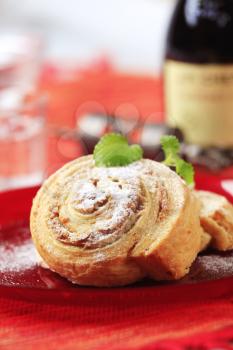 Sweet pastry rolls with nut filling dusted with icing sugar