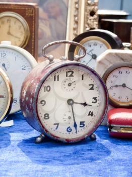 Selection of vintage clocks at flea market