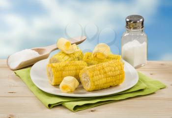 Boiled sweet corn with butter and salt