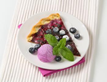 Slice of quark and blueberry flammkuchen with ice cream