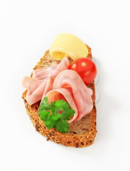 Slice of whole wheat bread with ham