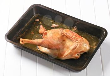 Roast chicken in a baking tray
