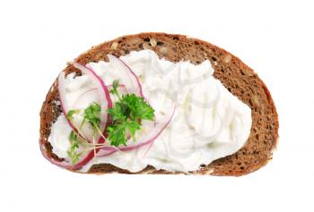 Slice of brown bread with cream cheese