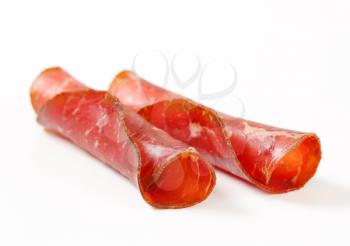 Slices of smoked marinated beef - rolled up