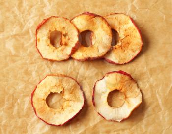 Apple chips on baking parchment paper